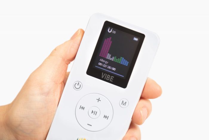 Resona Health Vibe PEMF Device in Hand - Showing Active Protocol Display